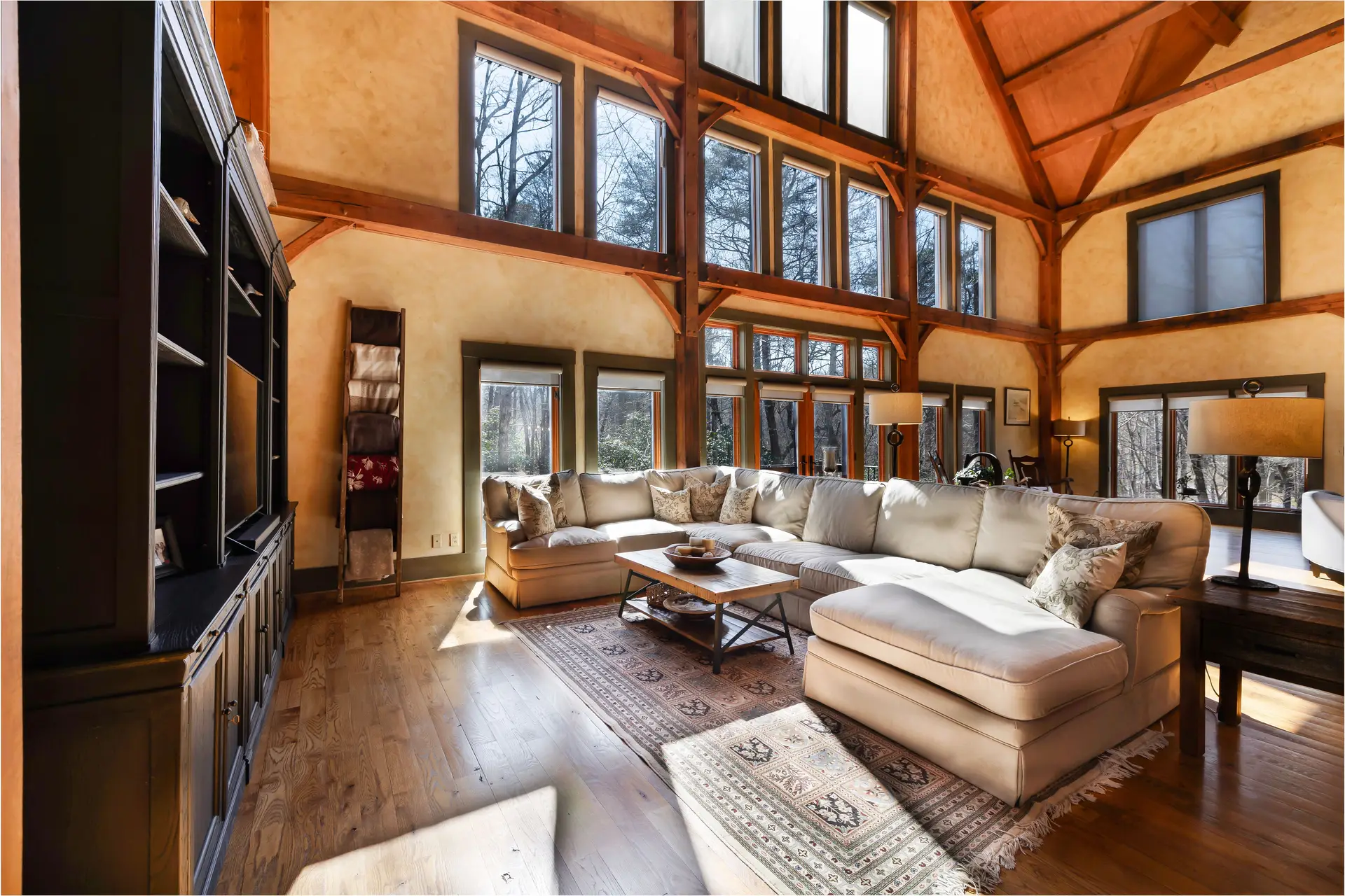 Nelson Coastal Retreat with raw timber rafters and linen drape system