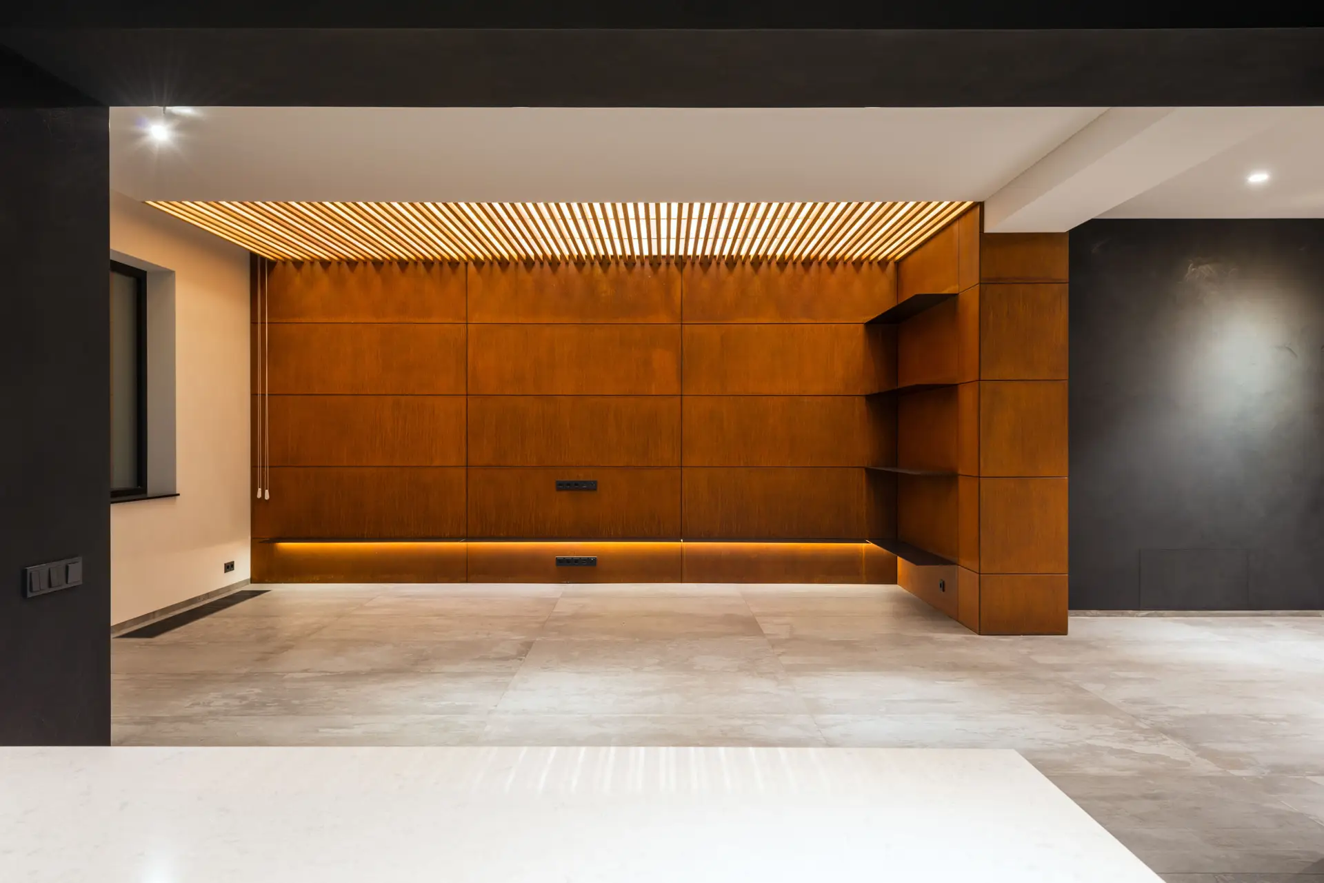 Warm architectural cabinetry and marble finishes in contemporary interior