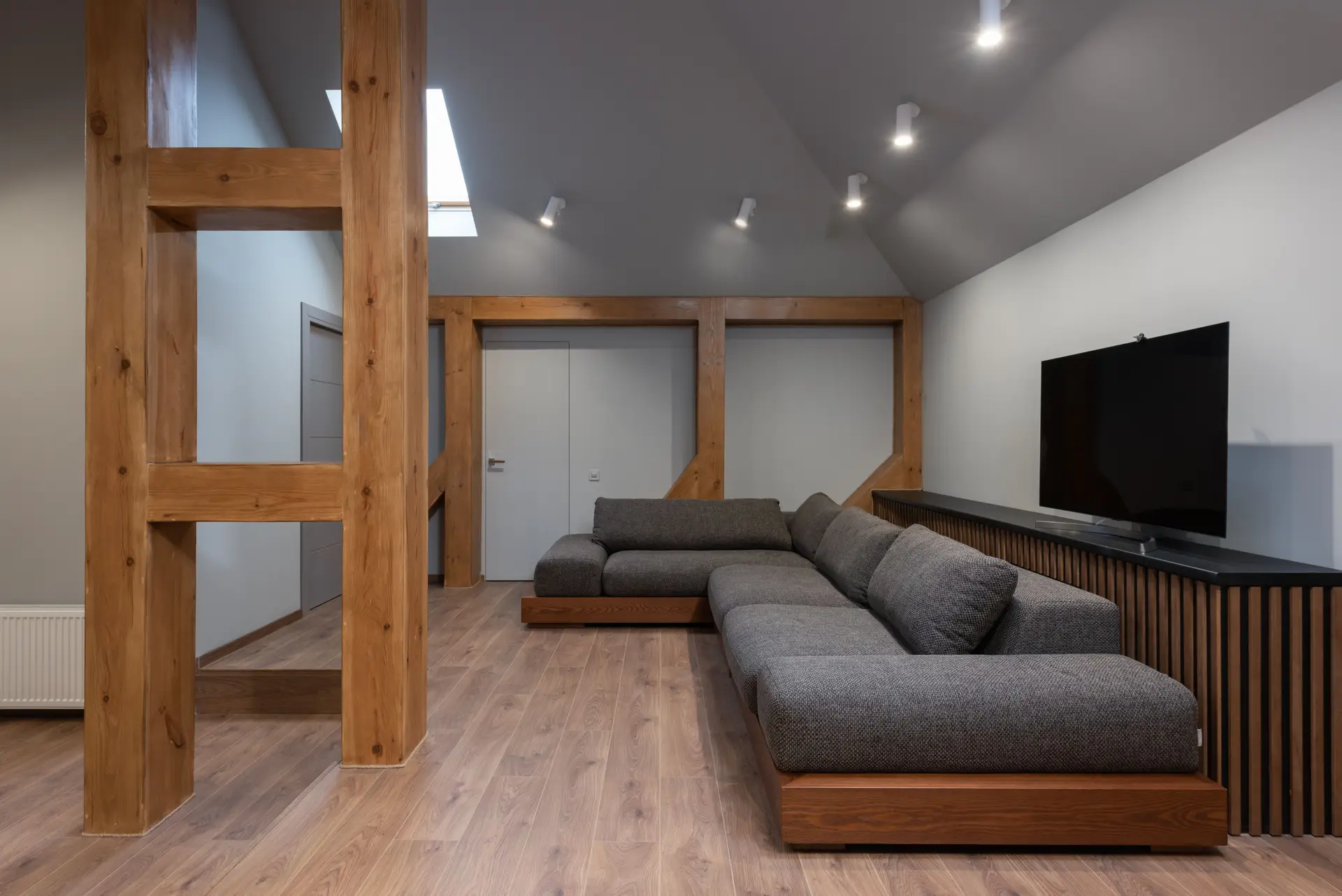 Hawke's Bay Pavilions open plan living space with limestone floor and wool sofa