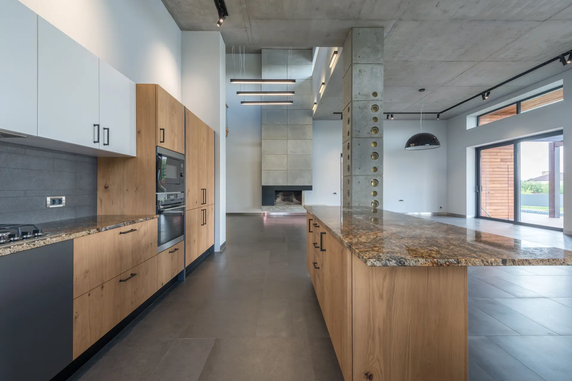 Spacious dining space with solid timber table and sculptural seating